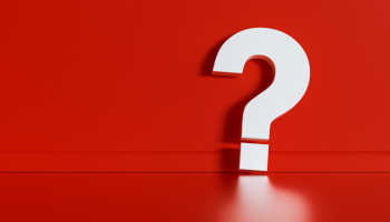 Large white question mark on a red background