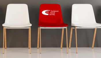 Trhee chairs in a row, the centre one is red and has the ESS logo printed on it.